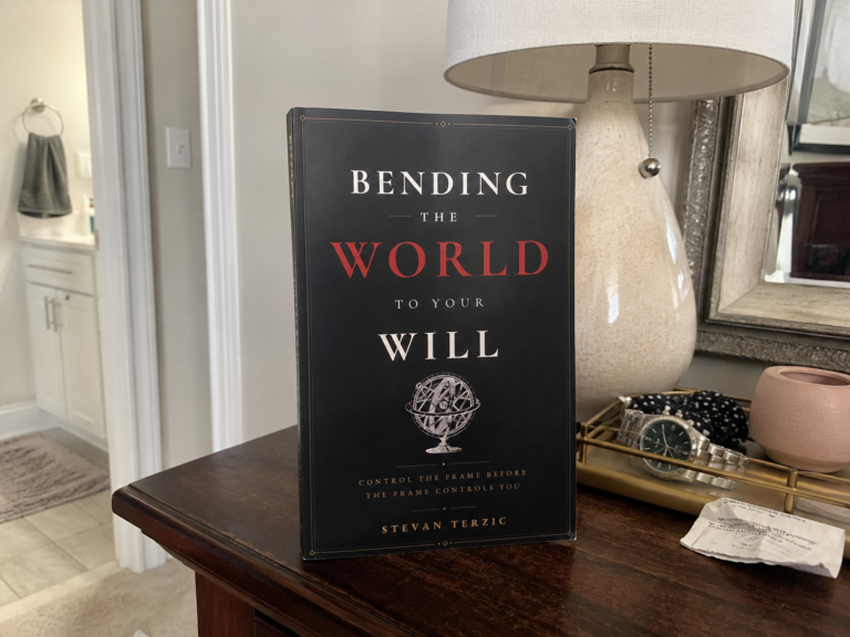 Bending the World to Your Will standing beside a lamp