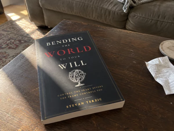 Illustrative scene: the paperback on a coffee table
